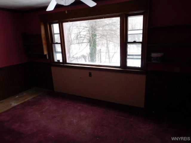 unfurnished room featuring a ceiling fan