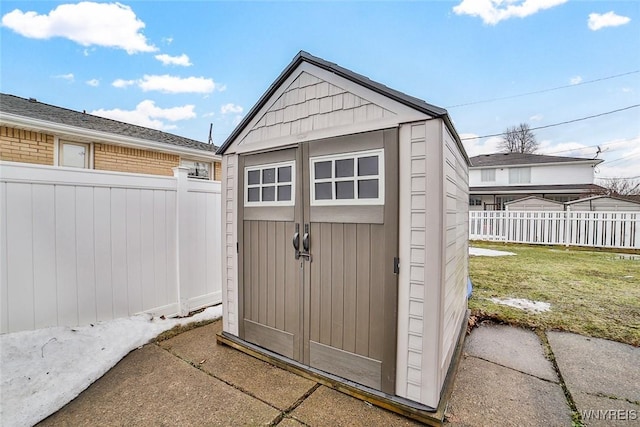 view of shed with a fenced backyard