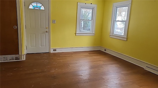 entryway featuring wood finished floors and baseboards