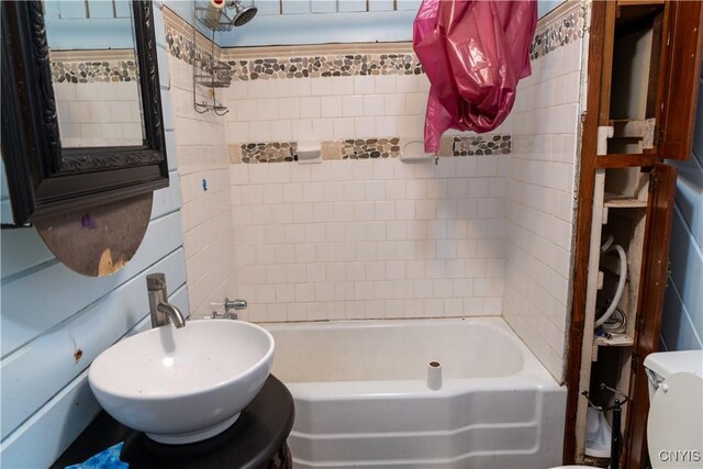 full bath featuring bathtub / shower combination and a sink