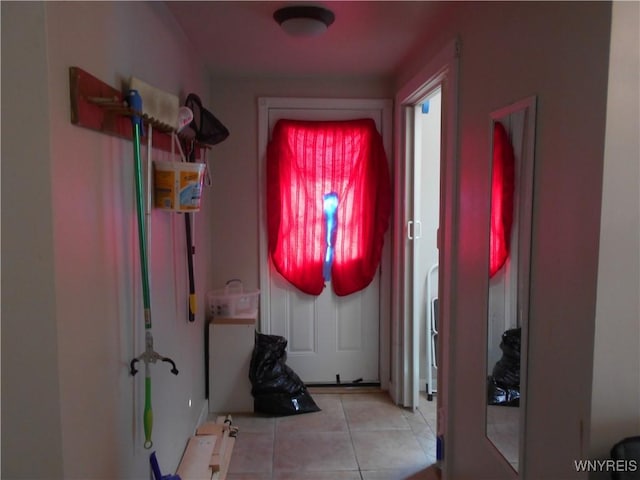 entryway with light tile patterned flooring