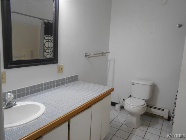 full bathroom featuring curtained shower, toilet, vanity, baseboard heating, and tile patterned floors