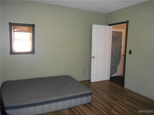 bedroom with wood finished floors