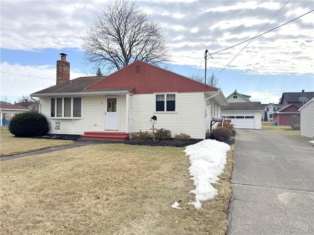 view of front of home featuring a front yard, an outdoor structure, and a chimney