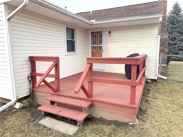 wooden terrace featuring fence