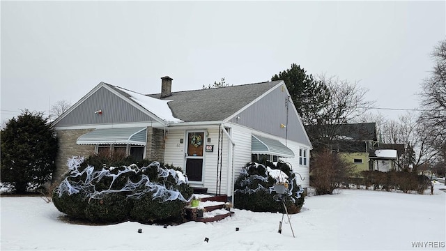 bungalow-style house with a chimney