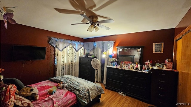 bedroom featuring ceiling fan and wood finished floors