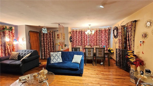 interior space featuring an inviting chandelier and wood finished floors