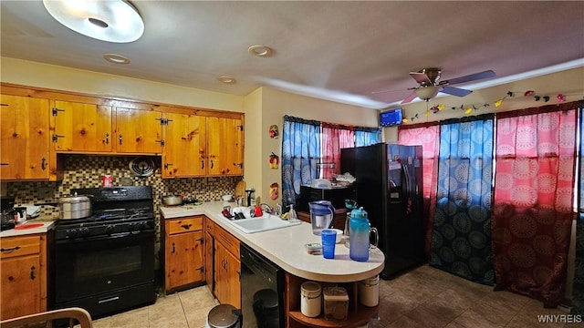 kitchen with open shelves, light countertops, brown cabinetry, a sink, and black appliances