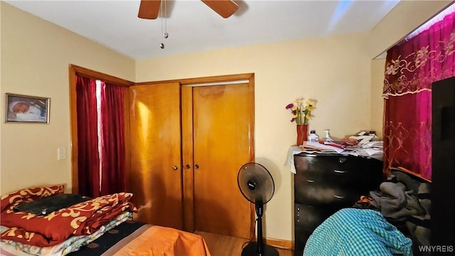 bedroom featuring a closet and a ceiling fan