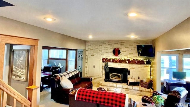 living area featuring a fireplace and recessed lighting