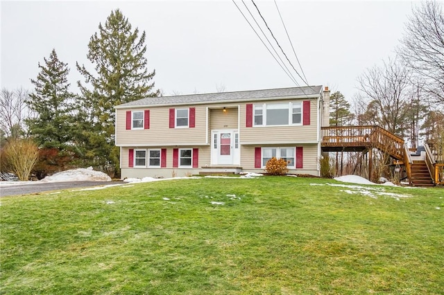 split foyer home featuring a front lawn