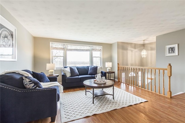 living room featuring baseboards and wood finished floors