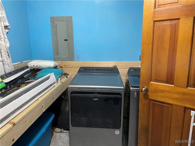 laundry room featuring laundry area, electric panel, and separate washer and dryer