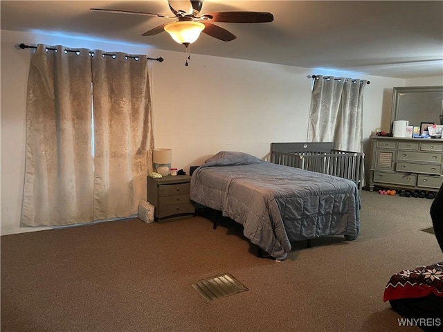 carpeted bedroom featuring a ceiling fan