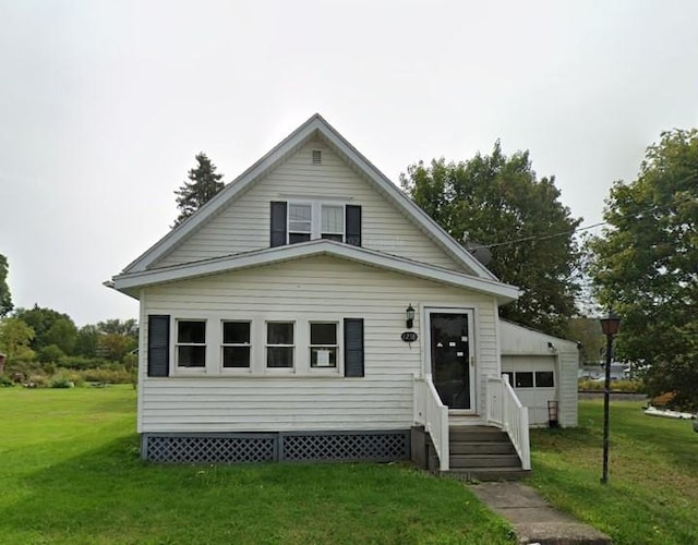 bungalow-style house with entry steps and a front lawn