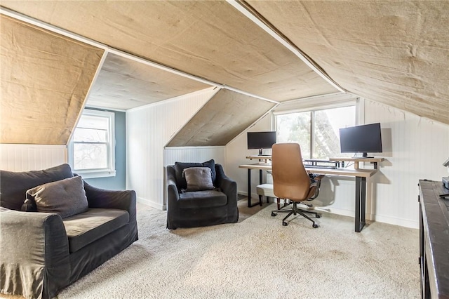 office area featuring carpet, lofted ceiling, and baseboards