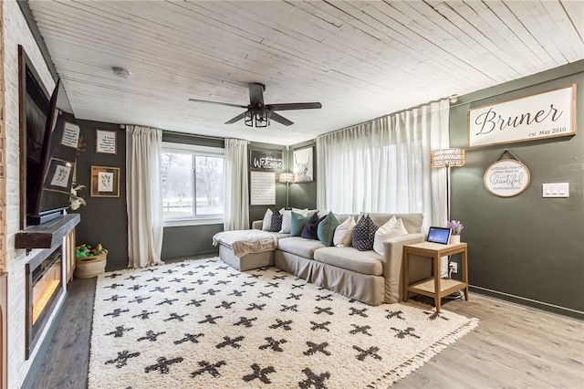 interior space featuring wooden ceiling, ceiling fan, and wood finished floors