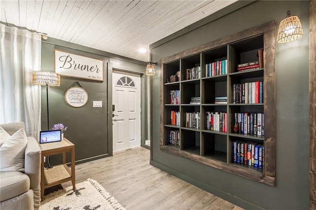 interior space with wooden ceiling and wood finished floors