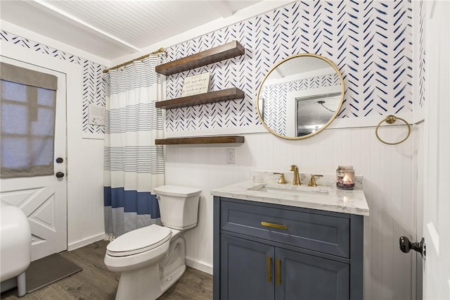 full bathroom featuring toilet, wood finished floors, and vanity