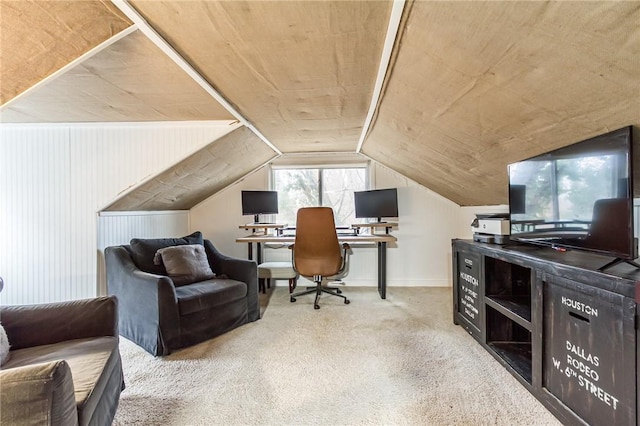 carpeted office space with vaulted ceiling