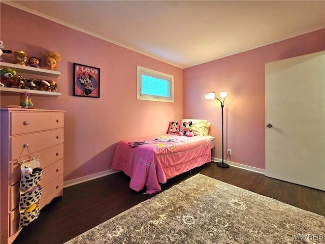 bedroom featuring baseboards, ornamental molding, and dark wood-type flooring