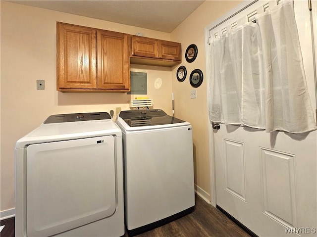 washroom with dark wood-style flooring, independent washer and dryer, cabinet space, and baseboards