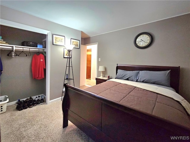 bedroom with carpet floors and baseboards