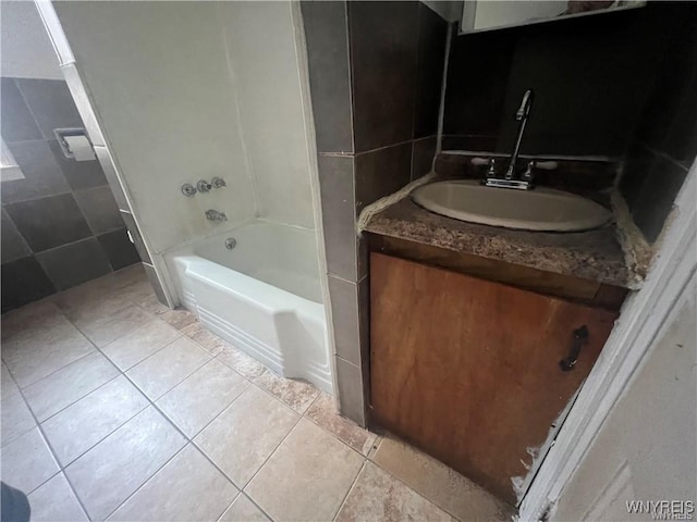 full bathroom with vanity, tile walls, and tile patterned floors