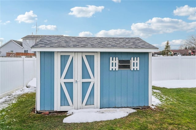 view of shed featuring a fenced backyard