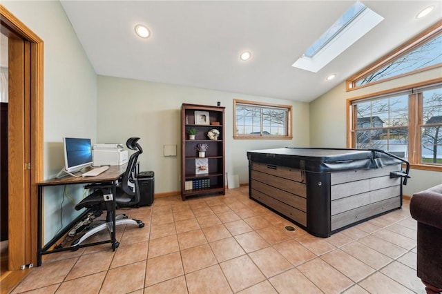 office with lofted ceiling with skylight, recessed lighting, baseboards, and light tile patterned floors