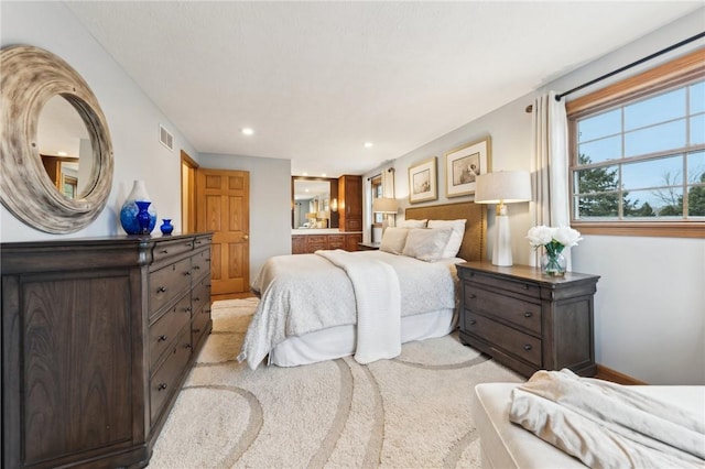 bedroom with visible vents and recessed lighting