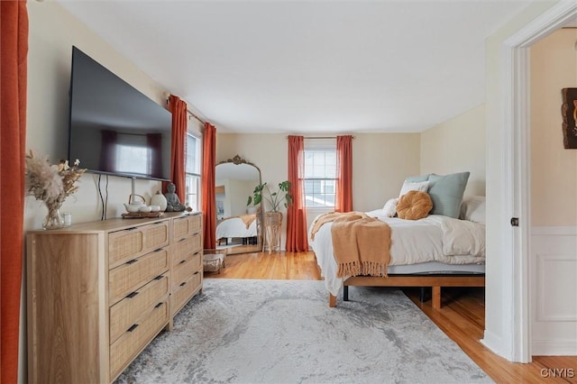 bedroom featuring light wood-style floors