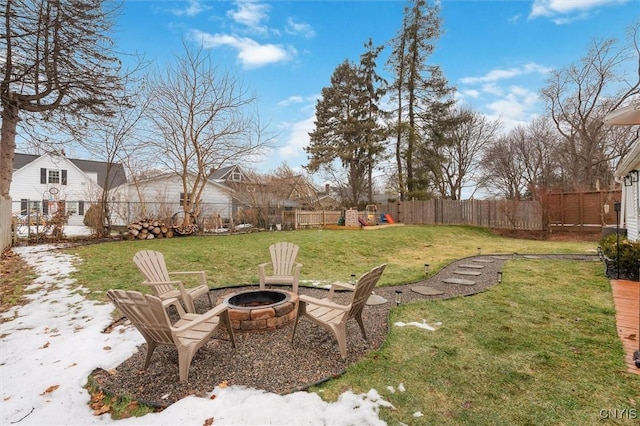 view of yard featuring an outdoor fire pit and fence private yard