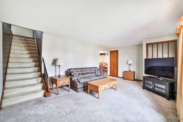 living area with stairway, carpet, and baseboards