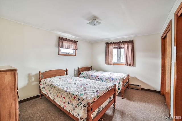 carpeted bedroom with baseboards and baseboard heating