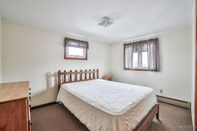 bedroom featuring a baseboard radiator and dark colored carpet