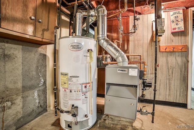 utility room featuring gas water heater