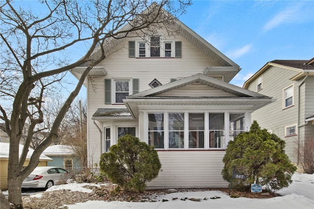 view of front of house with a sunroom