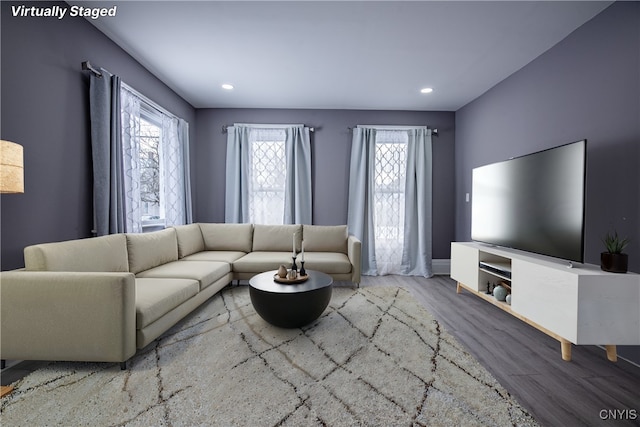 living area featuring wood finished floors, a wealth of natural light, and recessed lighting