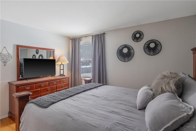 bedroom featuring wood finished floors