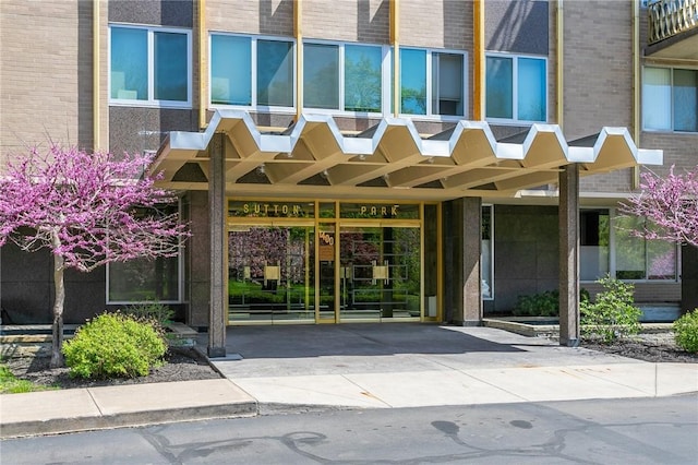 entrance to property with brick siding