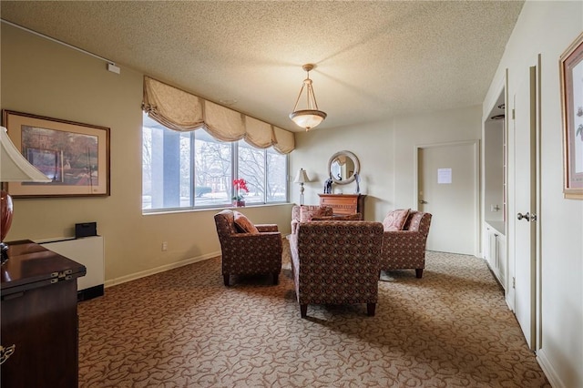 carpeted dining space featuring a textured ceiling and baseboards