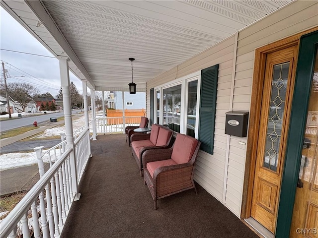 view of patio featuring a porch