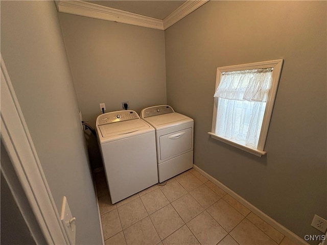 laundry room featuring light tile patterned floors, laundry area, separate washer and dryer, baseboards, and crown molding