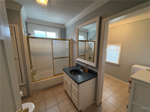 bathroom featuring enclosed tub / shower combo, a textured ceiling, vanity, tile patterned floors, and crown molding