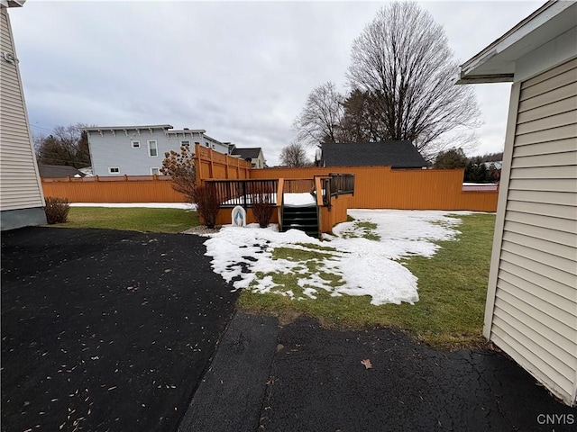 view of yard featuring fence and a wooden deck