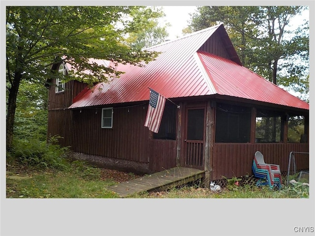 view of home's exterior with metal roof