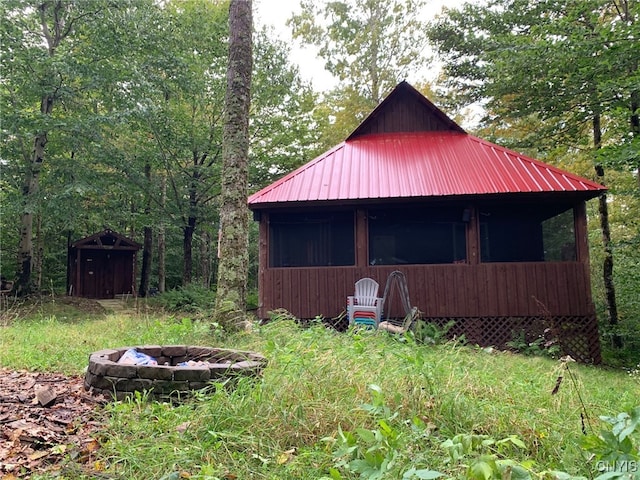 view of shed with a fire pit