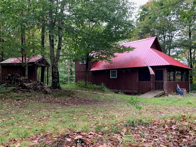 exterior space featuring metal roof